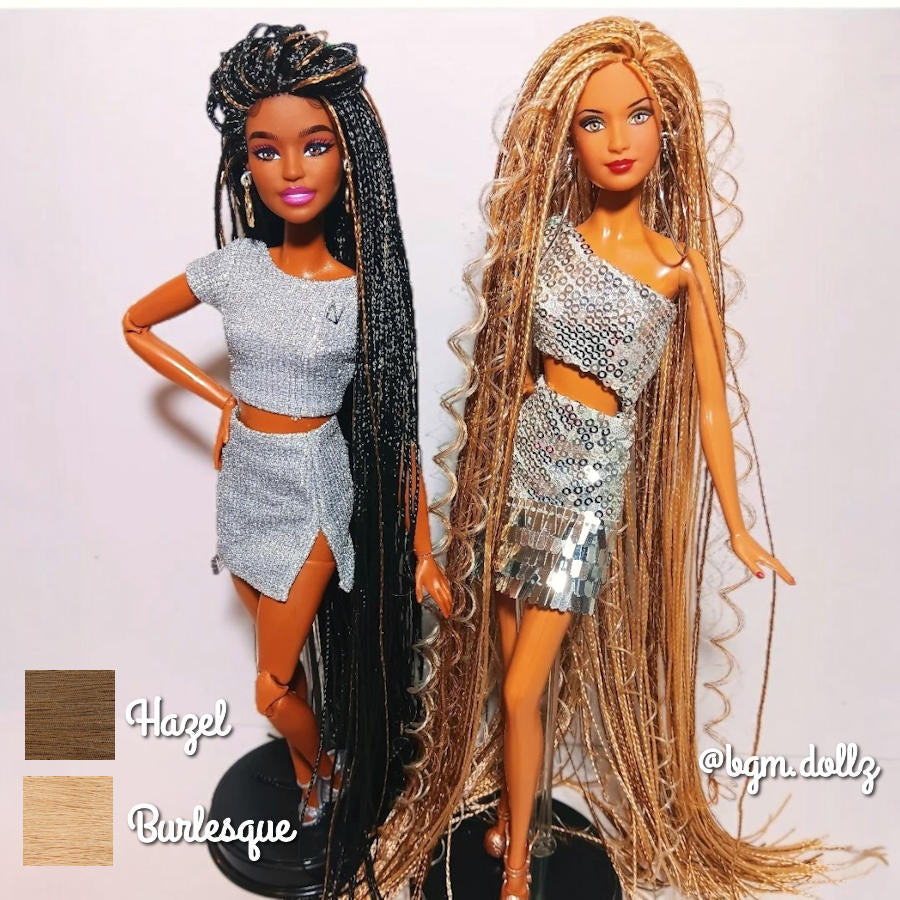 Two custom-rooted fashion dolls standing side-by-side. The doll on the right features ultra-long, cascading Burlesque Blonde and Hazel Blonde nylon micro braids that extend past her knees with a rich, dimensional golden luster and crimped texture.