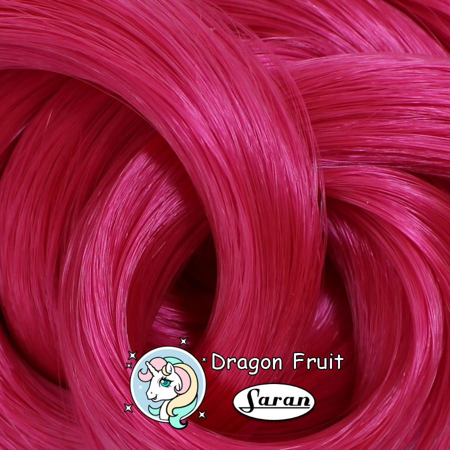 Close-up of Dragonfruit hot pink saran doll hair for rerooting and restoration.