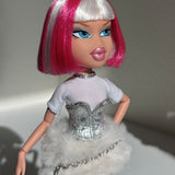 Three-quarter angle of custom Bratz Charmz Cloe rerooted with Shimmer Locks Dragonfruit hot pink and Ivory white saran doll hair by @thedolldaddie. Highlights the blunt bob cut, front bangs, and two-tone color contrast under direct light.