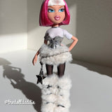 Full-body shot of custom Bratz Charmz Cloe styled in winter fur outfit with Shimmer Locks Dragonfruit hot pink and  Ivory white saran doll hair by @thedolldaddie. Shows the overall sleek bob style and two-tone hair placement.
