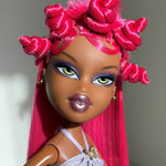 Close-up custom reroot example of Dragonfruit hot pink saran doll hair on Bratz Pop Starz Sasha by @thedolldaddie. Detailed shot highlighting the styled Bantu knots and hair color match.