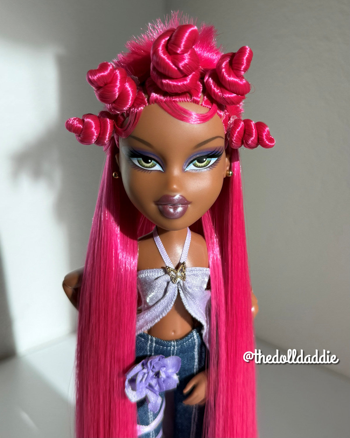 Front portrait view of Dragonfruit hot pink saran doll hair on a custom Bratz Pop Starz Sasha by @thedolldaddie. Highlights symmetry, length, and fiber sheen under direct light.
