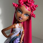 Angled portrait of custom Bratz Pop Starz Sasha rerooted with Dragonfruit hot pink saran doll hair by @thedolldaddie. Shows how direct sunlight hits the fiber.