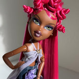 Angled portrait of custom Bratz Pop Starz Sasha rerooted with Dragonfruit hot pink saran doll hair by @thedolldaddie. Shows how direct sunlight hits the fiber.