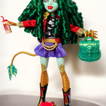 Full body shot of a Monster High G3 Jinafire Long doll restyled with a full head of voluminous emerald green curly nylon hair from Shimmer Locks.