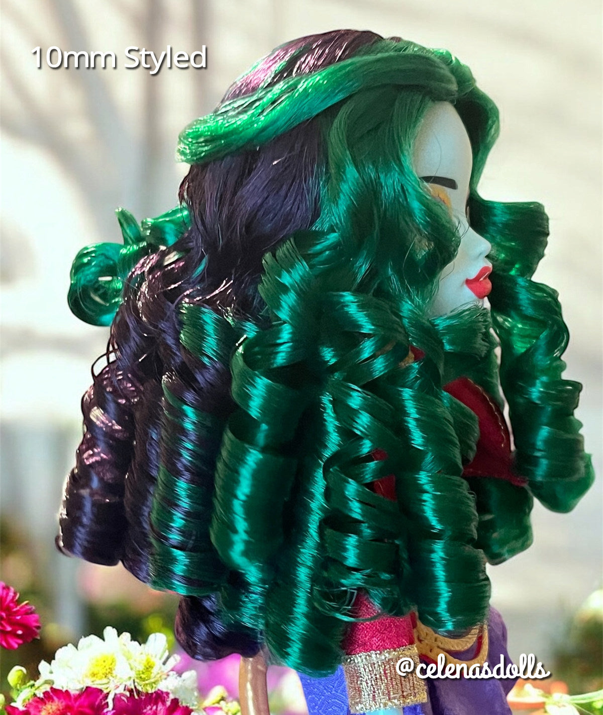 Side profile of a Monster High G3 Jinafire Long doll featuring a custom reroot with emerald green and Dark Embrace purple 10mm curly nylon hair from Shimmer Locks