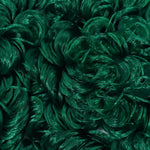 Close-up of emerald green curly nylon doll hair by Shimmer Locks showing tight, defined ringlets. Great for rerooting Barbie and Monster High dolls.
