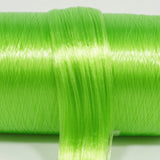 Funhouse Green nylon doll hair spool by Shimmer Locks. Smooth, bright lime green fiber on the roll, a touch lighter than Kiwi Tart.