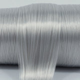 Granite Gray nylon doll hair spool by Shimmer Locks. Smooth, cool-toned stone gray fiber showing shine and texture on the roll
