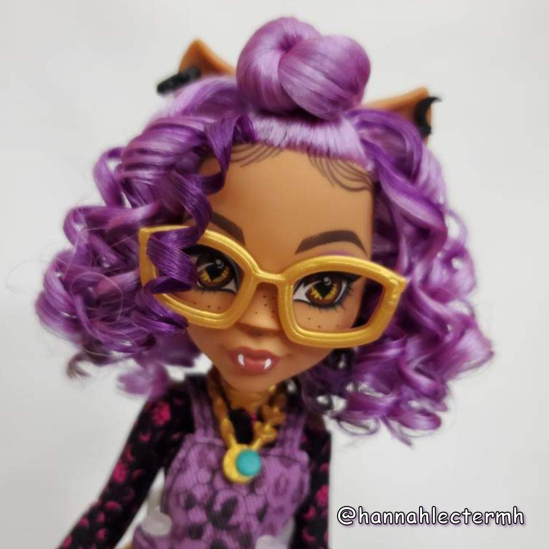 Profile shot of a custom Monster High Clawdeen doll head tightly styled Lilac Breeze light purple and Exotic Grap saran hair from Shimmer Locks. Rerooted by @hannahlectermh.
