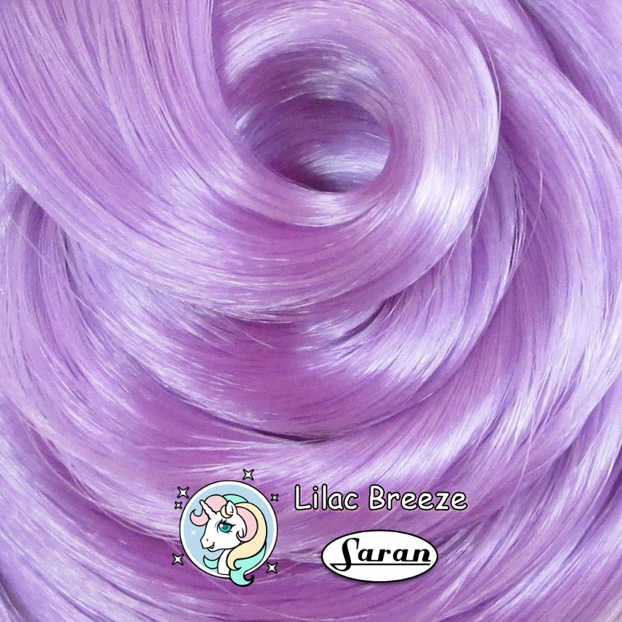 Close-up swatch of Lilac Breeze light pastel purple saran doll hair by Shimmer Locks showing smooth, glossy hair fiber. Great for rerooting Bratz and Barbie dolls.