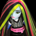 Close-up of Monster High Frankie Stein custom reroot showing a crisp side part with vibrant Pizzazz hot pink nylon hair. Rerooted by @celenasdolls.
