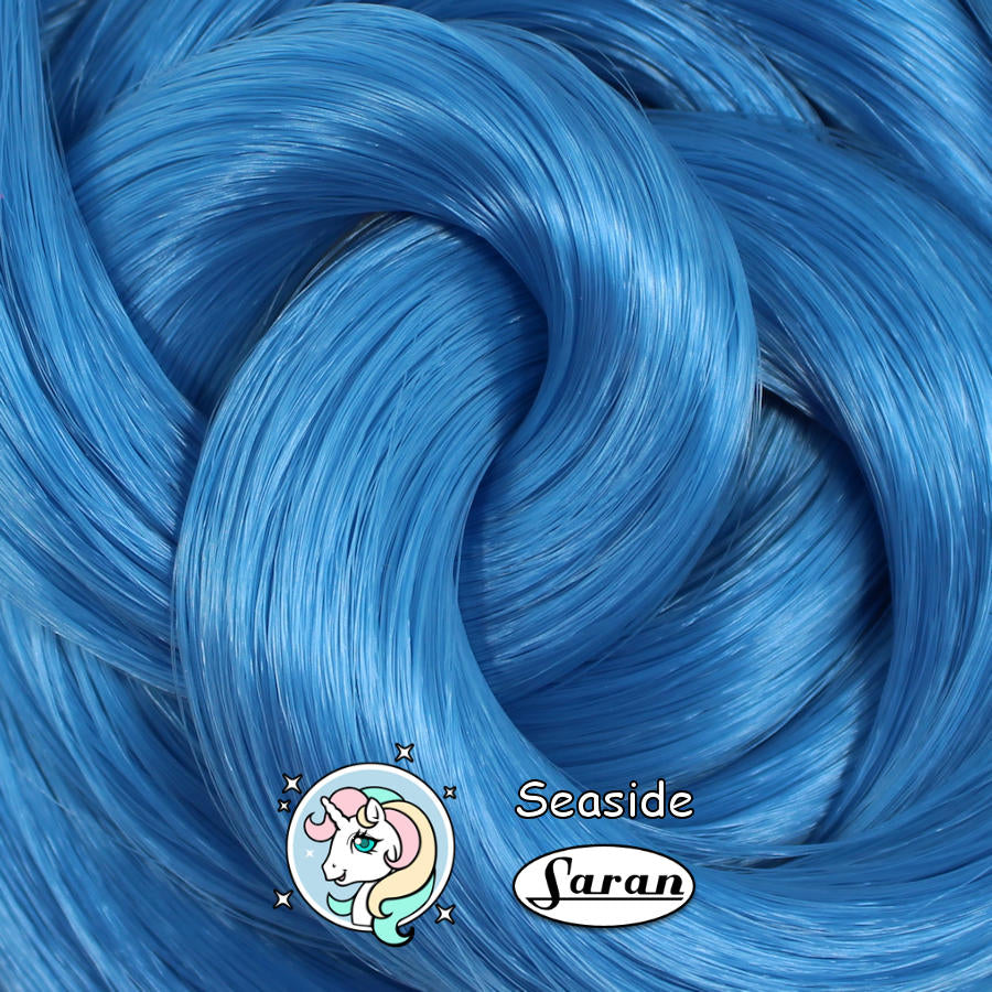 Seaside Blue premium Japanese Saran doll hair showing its bright blue color, silky texture, and beautiful luster