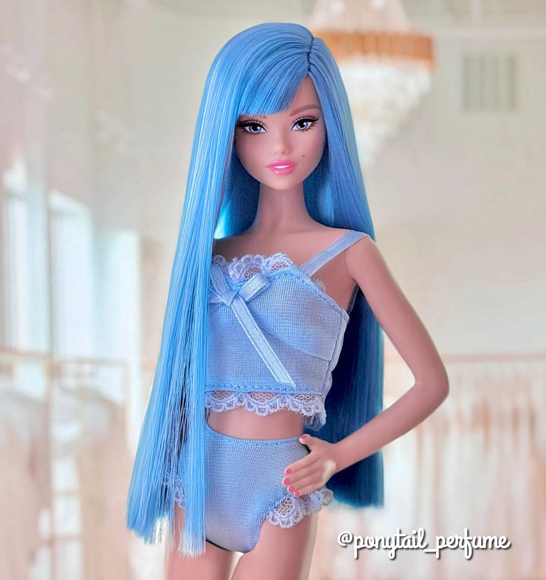 Custom Barbie doll with long, poker straight Seaside Blue Saran hair and blunt bangs, showcasing the flat scalp layout and heavy, silky drape of the ocean blue Japanese fiber.