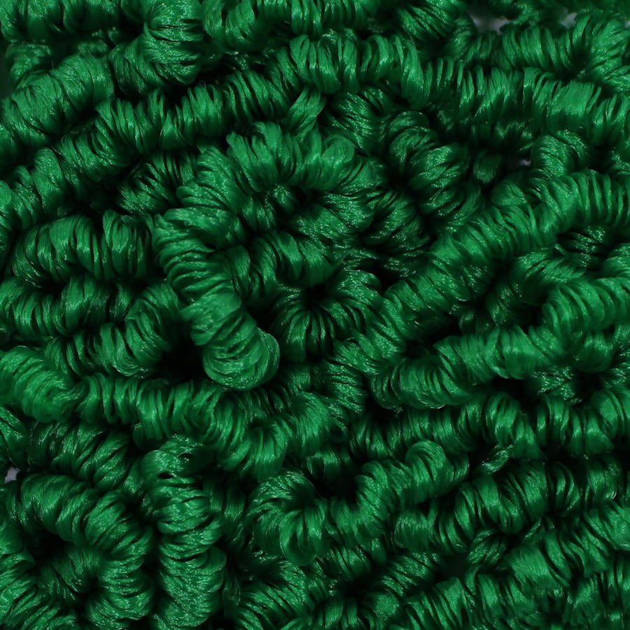 Close-up texture of Valley Green rich emerald green curly nylon doll hair in a tight 3mm curl size for custom doll rerooting and restoration.