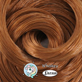 Close-up coil of Whiskey warm brown saran doll hair by Shimmer Locks, ideal for vintage Barbie and Bratz reroots