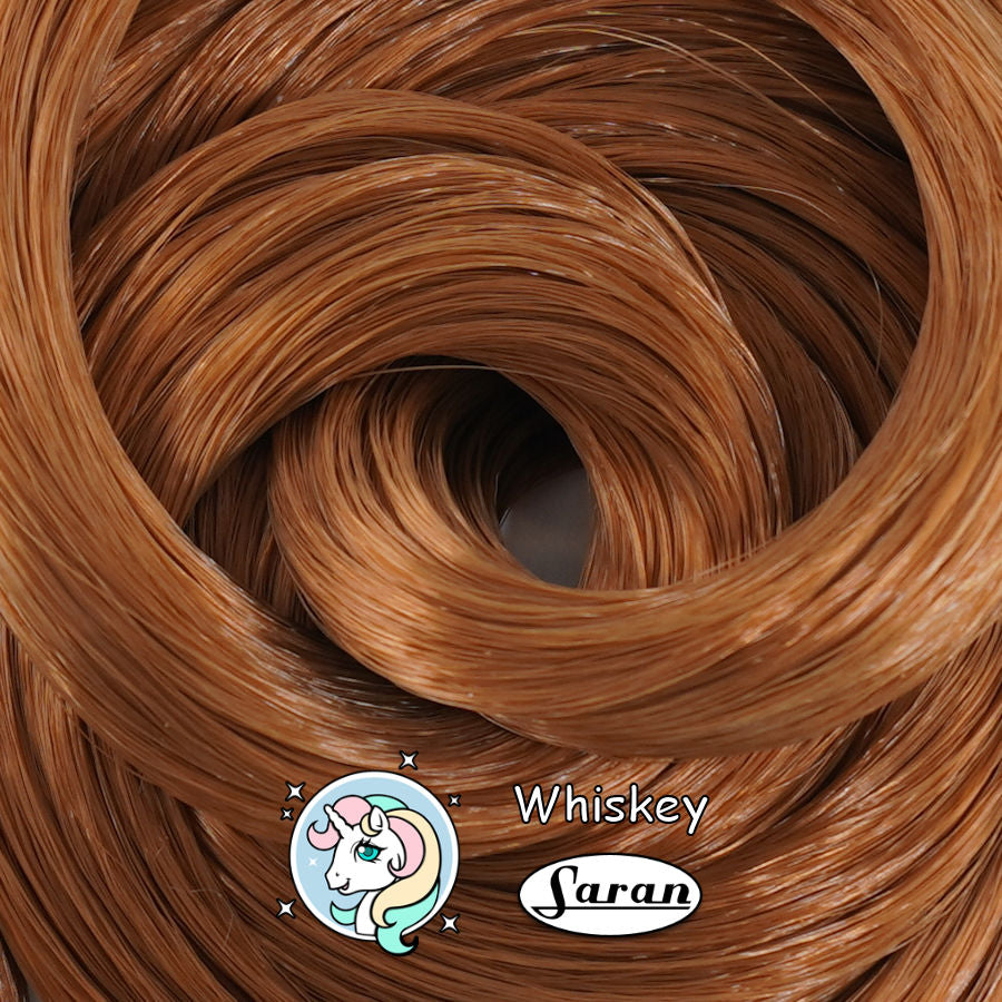 Close-up coil of Whiskey warm brown saran doll hair by Shimmer Locks, ideal for vintage Barbie and Bratz reroots